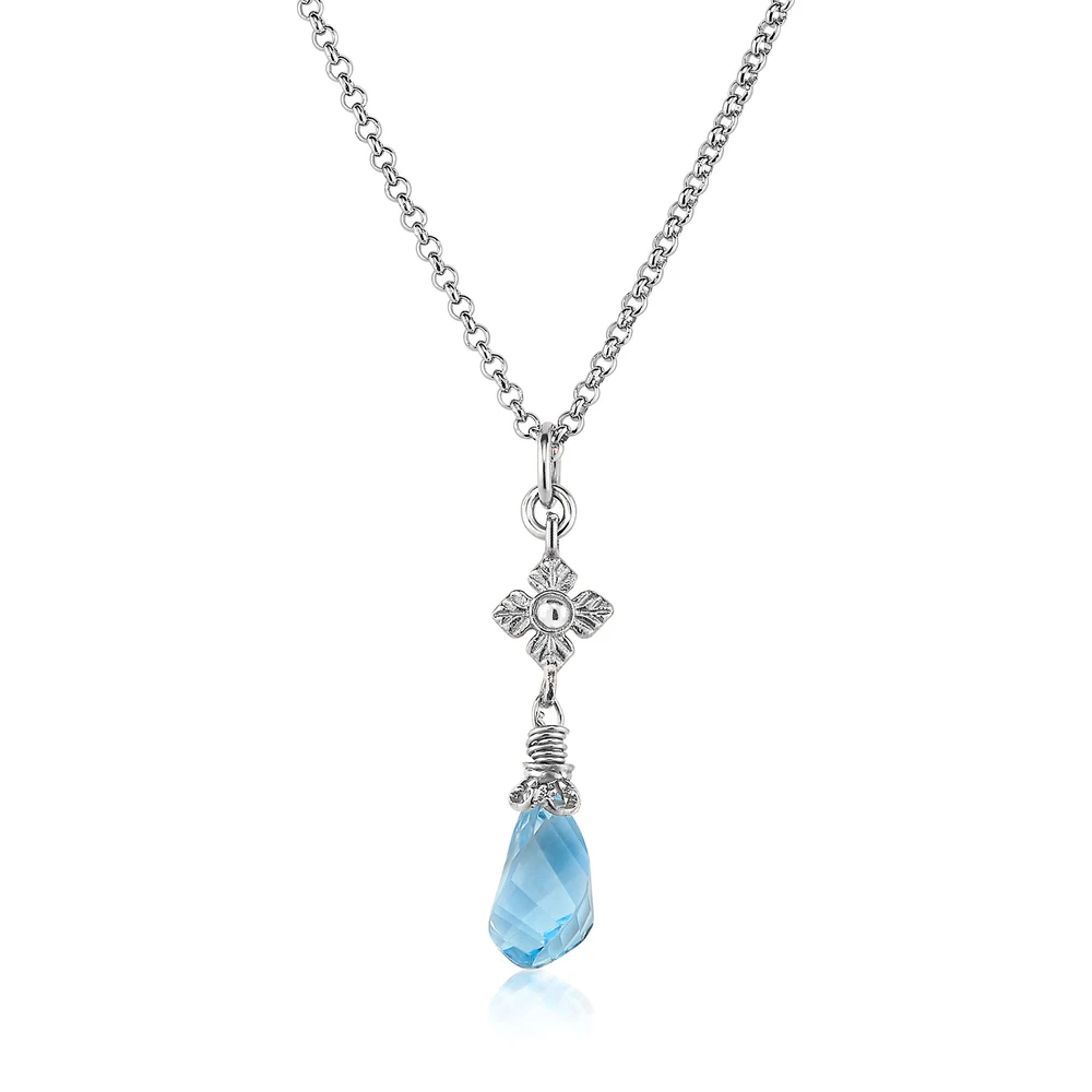 faceted blue topaz twist necklace with flower detail in silver