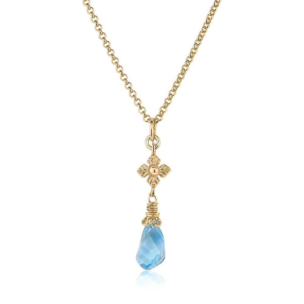 faceted blue topaz twist necklace with flower detail in gold