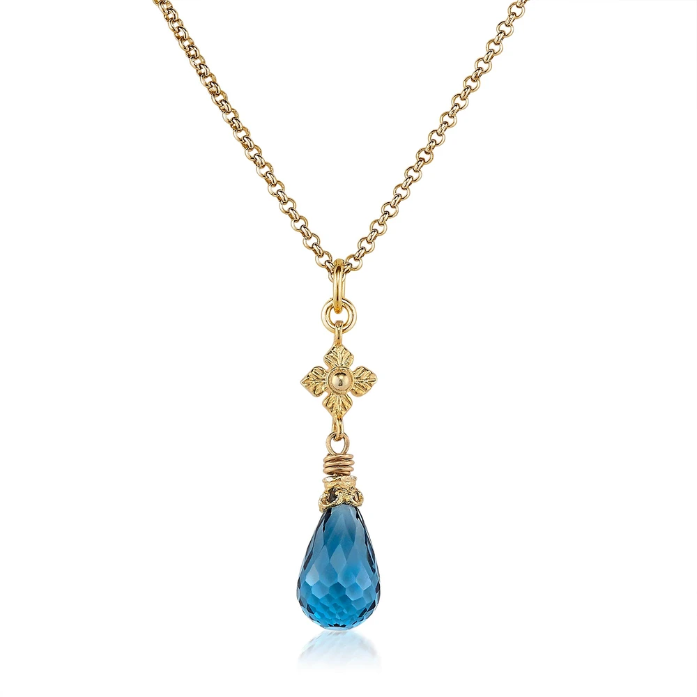 london blue topaz necklace with flower detail in gold